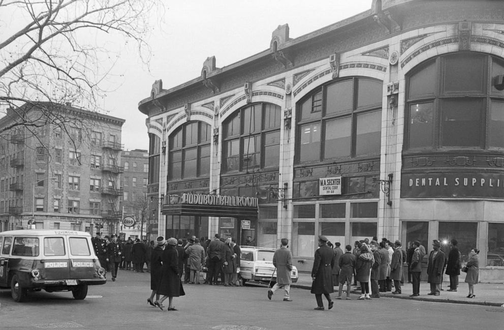PHOTO: Crowds and police officers stand outside the Audubon Ballroom prior to the appearance of Malcolm X, on Feb. 21, 1965 in New York City. The nationalist leader was later assassinated inside the ballroom.