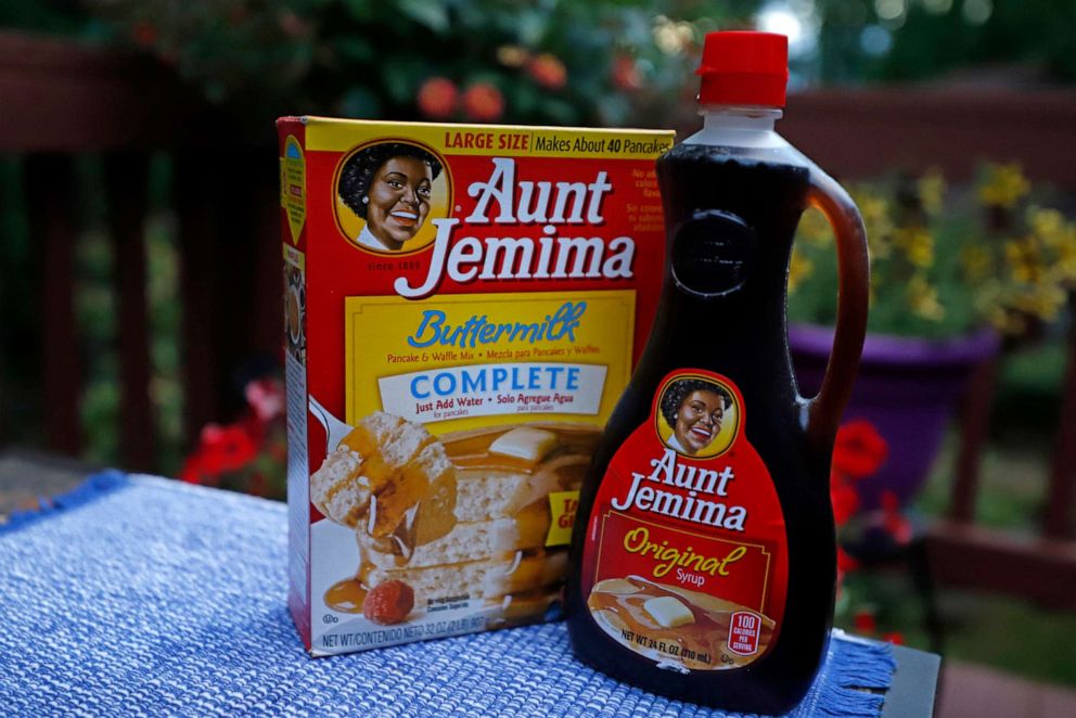 a box of Aunt Jemima Buttermilk Pancake and Waffle Mix sits next to a bottl...