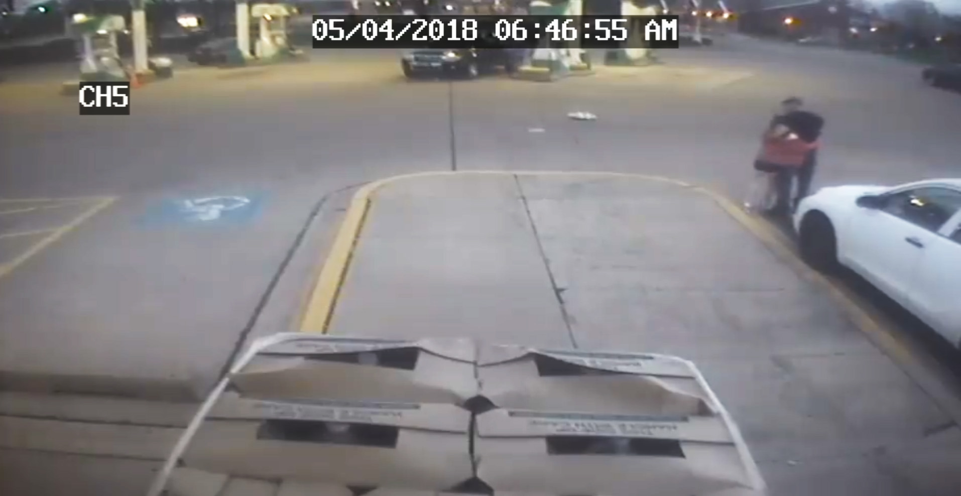 PHOTO: Surveillance video shows the moment an 11-year-old girl jumped out of a moving car as it was being carjacked from a gas station in Aurora, Colo. 
