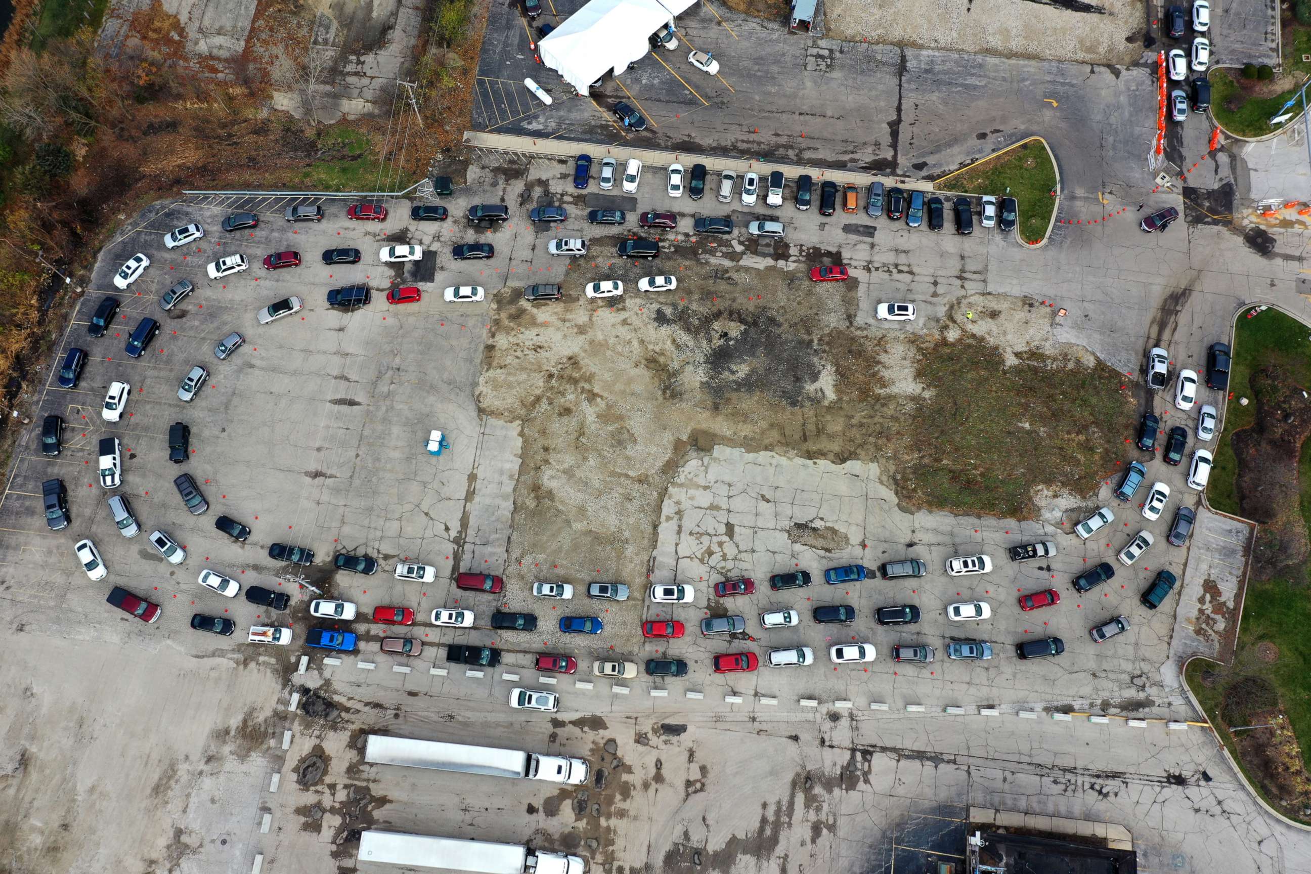 PHOTO: Residents in cars wait in line at a drive-up COVID-19 test site on Nov. 13, 2020 in Aurora, Illinois.
