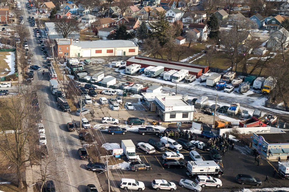 PHOTO: Law enforcement personnel gather near the scene of a shooting at an industrial park in Aurora, Ill., Feb. 15, 2019.