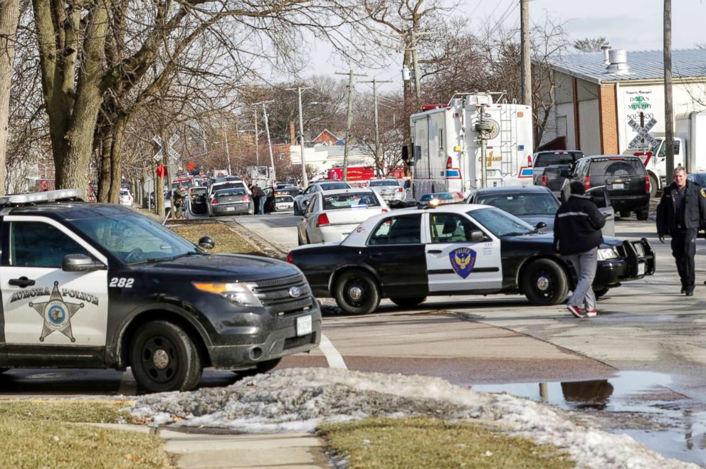 PHOTO: Law enforcement personnel gather near the scene of a shooting at an industrial park in Aurora, Ill., Feb. 15, 2019.