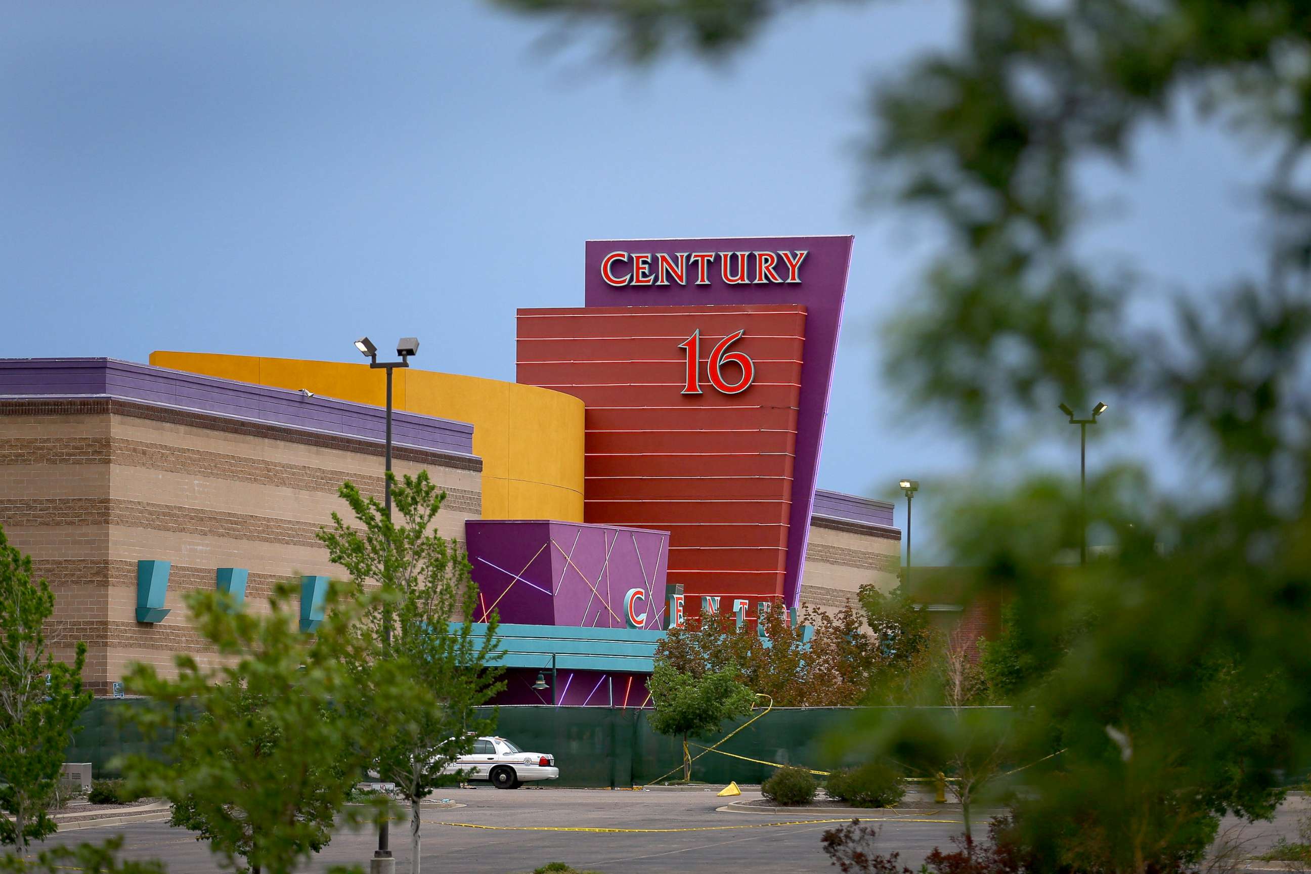PHOTO: The Century 16 movie theatre is seen from a memorial setup across the street, July 28, 2012 in Aurora, Colorado.