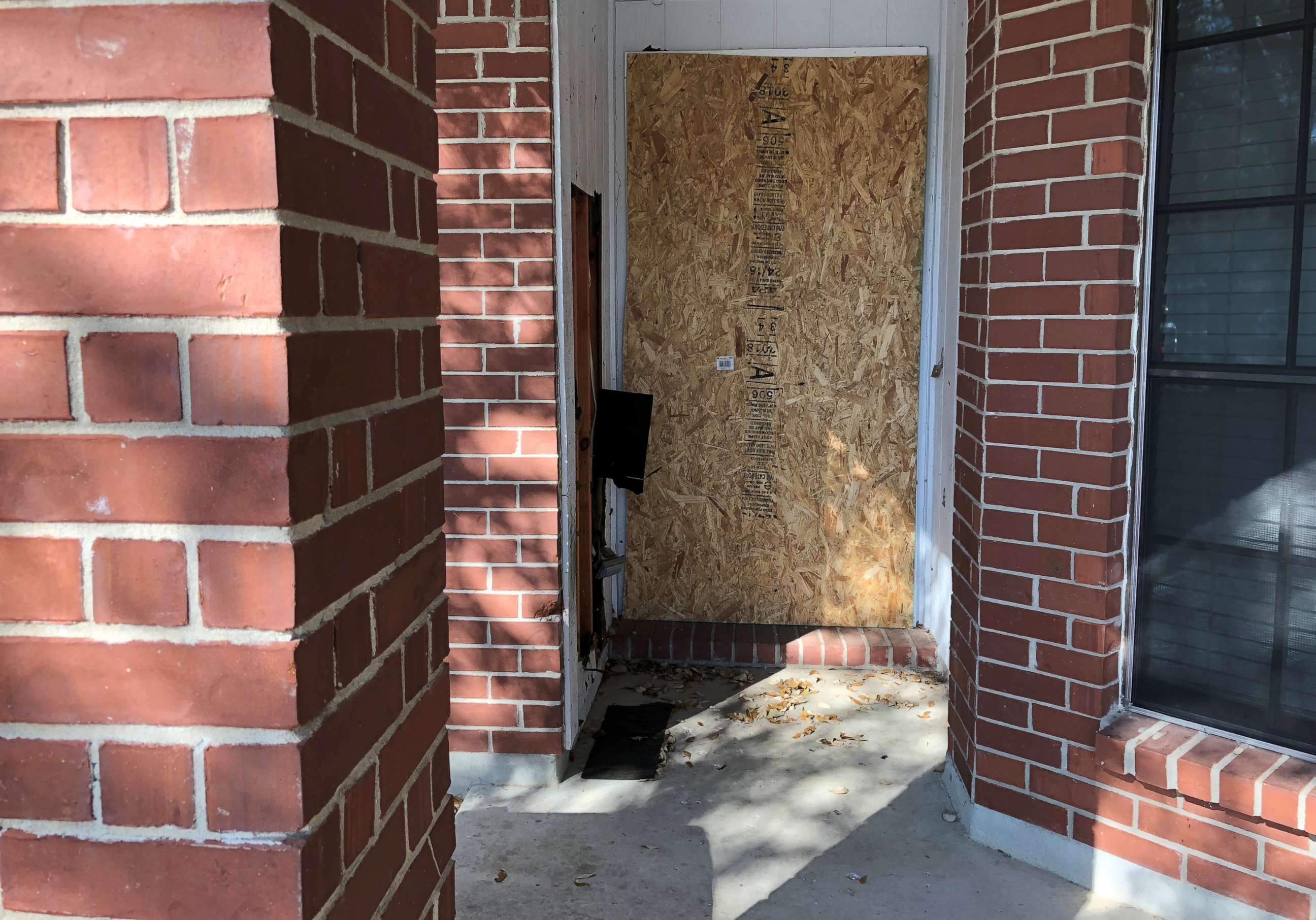 PHOTO: The doorway of a home where a fatal parcel bomb exploded on March 2, 2018, is seen boarded-up in Austin, Texas, March 12, 2018. 