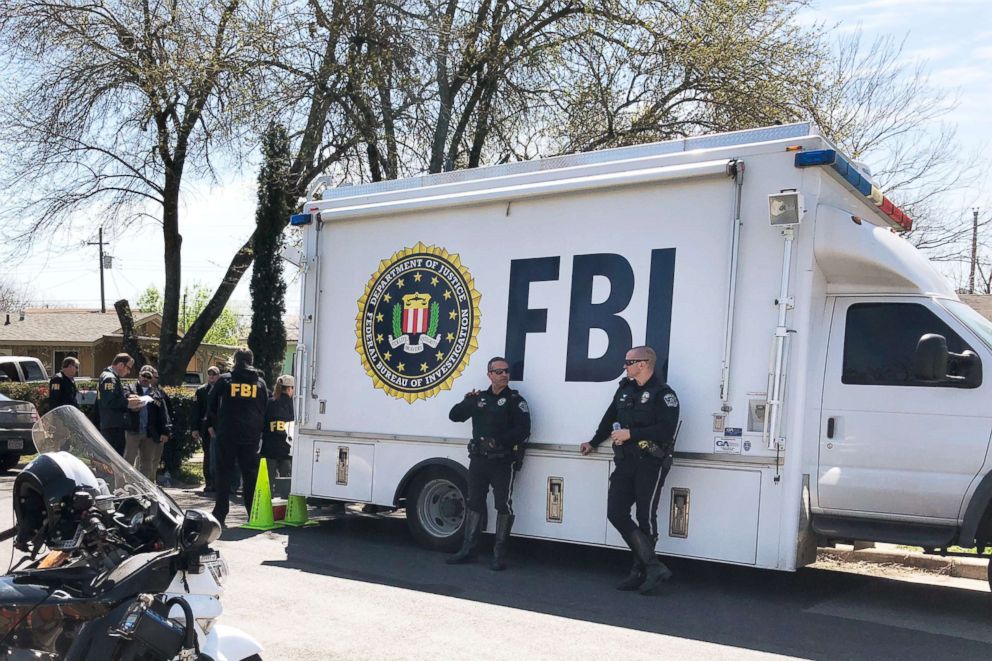 PHOTO: Law enforcement personnel including FBI agents are seen near a home where a parcel bomb exploded in Austin, Texas.  Authorities are continuing their investigation, March 13, 2018.  