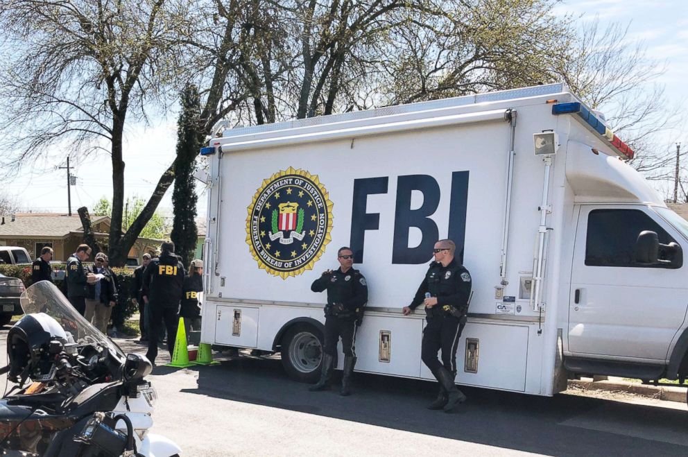 PHOTO: Law enforcement personnel including FBI agents are seen near a home where a parcel bomb exploded in Austin, Texas. Authorities are continuing their investigation, March 13, 2018.  