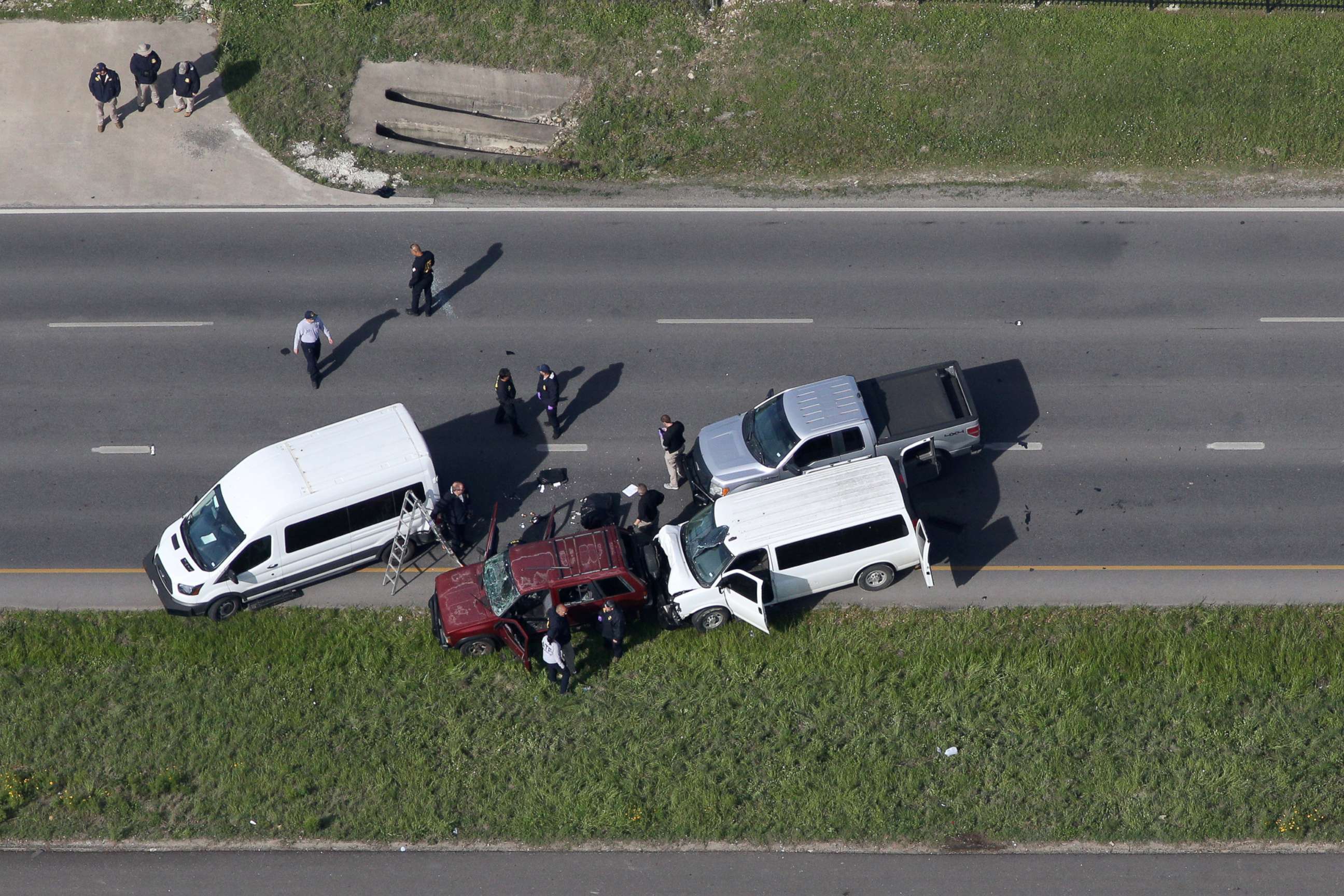 PHOTO: Law enforcement personnel investigate the scene where the Texas bombing suspect blew himself up on the side of a highway north of Austin in Round Rock, Texas, March 21, 2018.