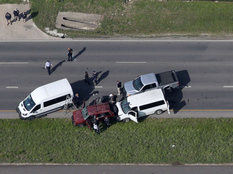 PHOTO: Law enforcement personnel investigate the scene where the Texas bombing suspect blew himself up on the side of a highway north of Austin in Round Rock, Texas, March 21, 2018.