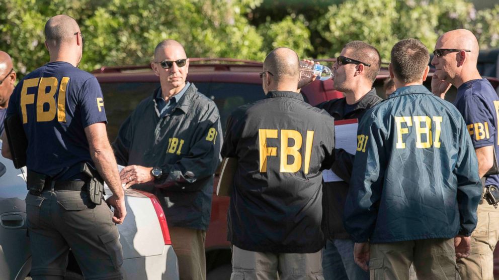 Austin police, FBI and ATF work the scene of a fourth package bomb in three weeks that exploded Sunday night on a southwest Austin roadside injuring two men, March 19, 2018, in Austin, Texas.