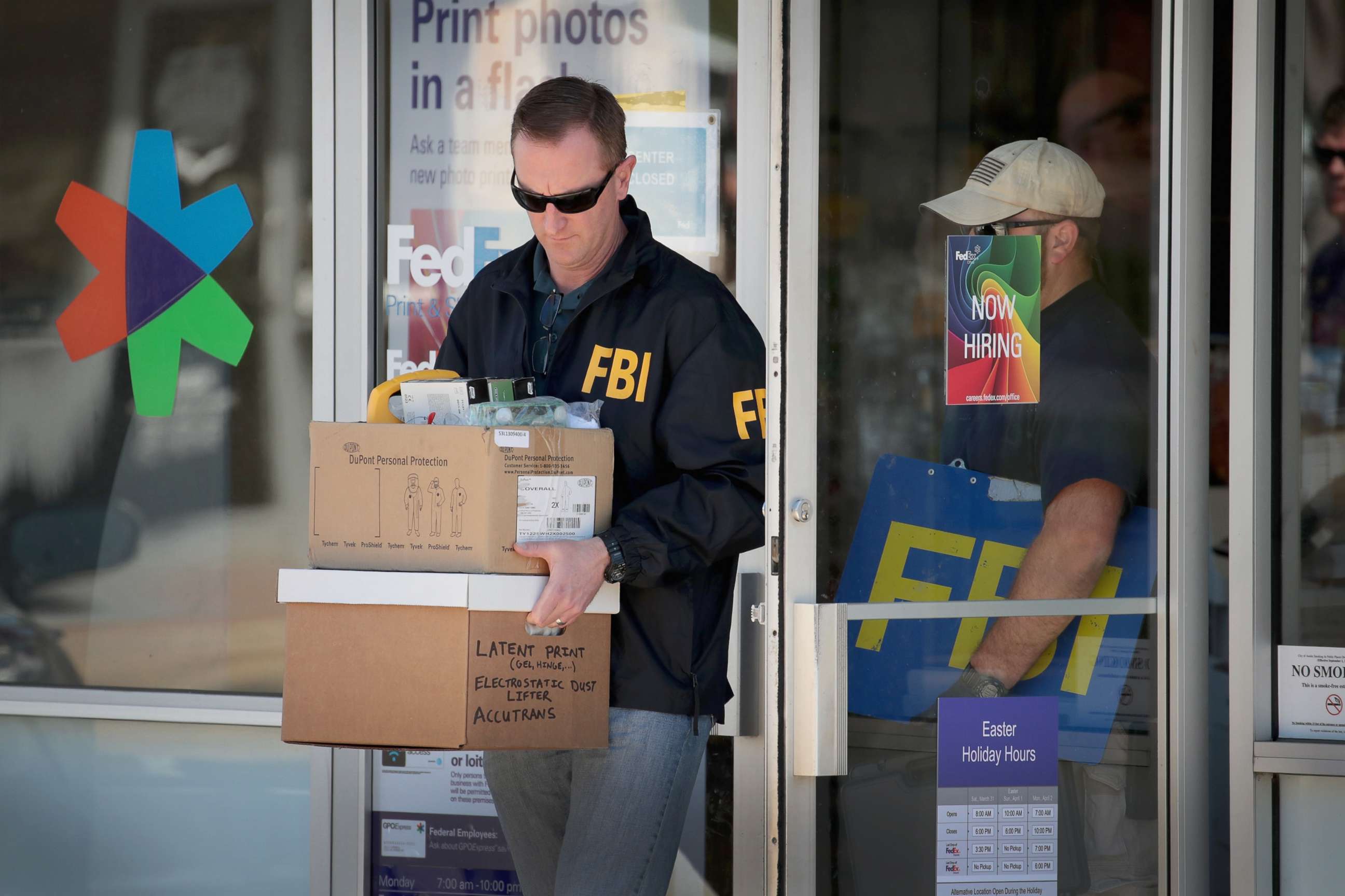 PHOTO: FBI agents collect evidence at a FedEx Office following an explosion at a nearby sorting center, March 20, 2018 in Sunset Valley, Texas. A package, reported to have been shipped from this store, exploded at a sorting facility in Schertz, Texas.