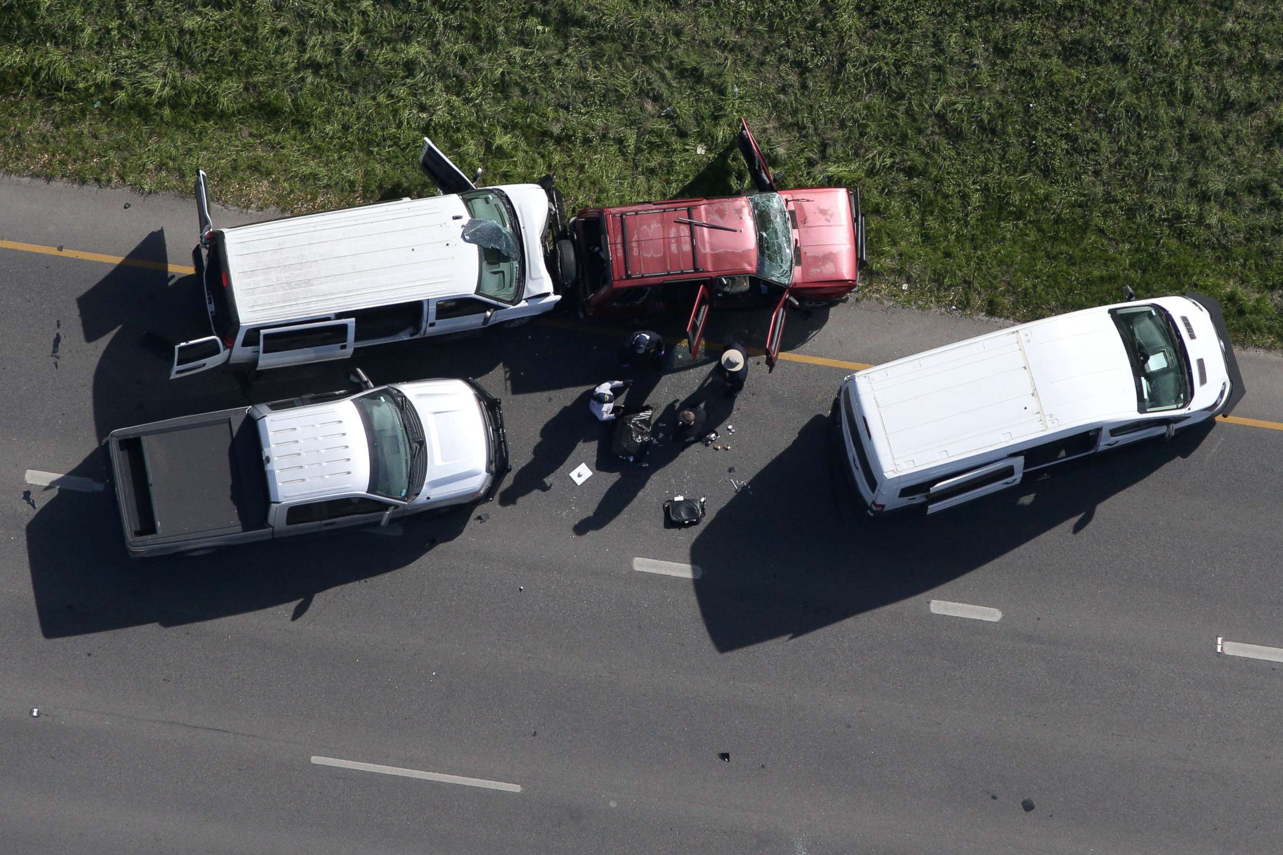 PHOTO: Law enforcement personnel investigate the scene where the Texas bombing suspect blew himself up on the side of a highway north of Austin in Round Rock, Texas, March 21, 2018.