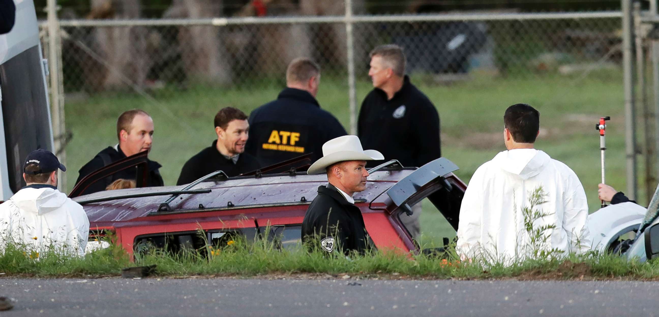 PHOTO: Officials investigate the scene where a suspect in a series of bombing attacks in Austin blew himself up as authorities closed in, March 21, 2018, in Round Rock, Texas.