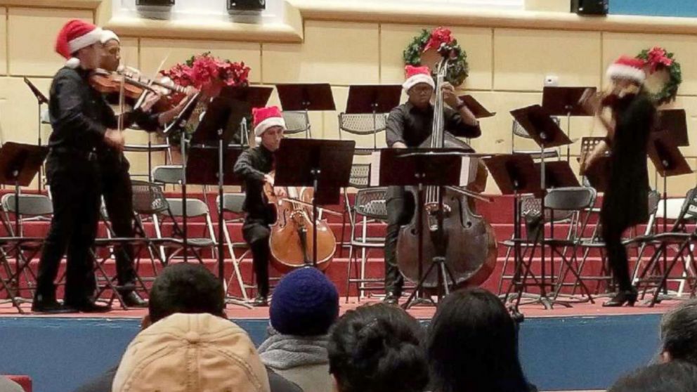 Shown here is Austin explosion victim Draylen Mason, third from left, performing on the bass during a concert. 
