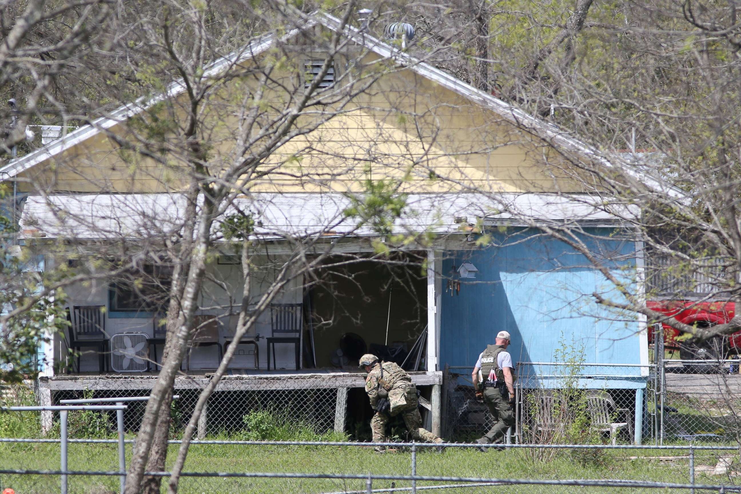 PHOTO: Law enforcement personnel investigate a home where the bomber was suspected to have lived in Pflugerville, Texas, March 21, 2018.