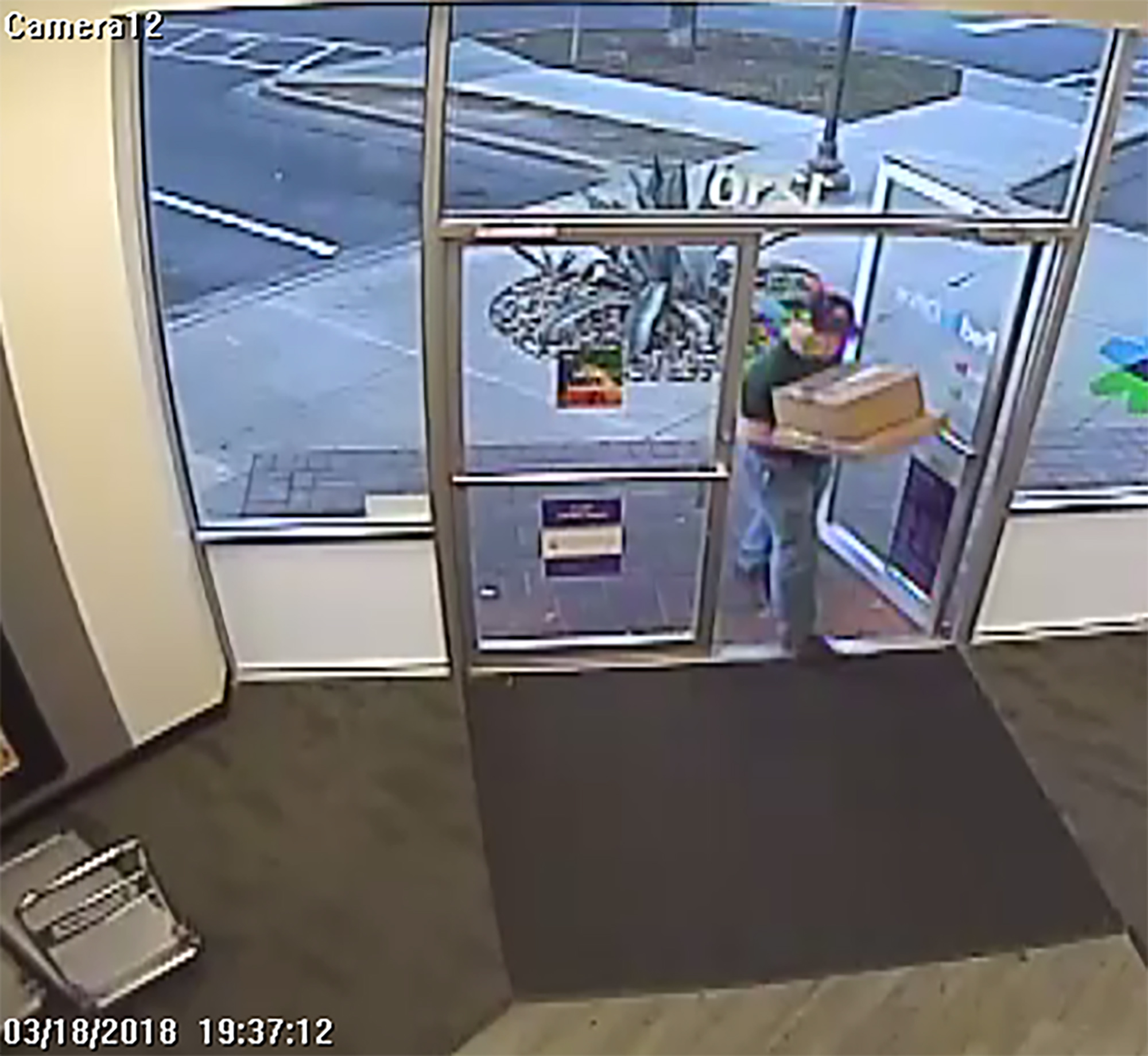 PHOTO: An image made from security camera footage appears to show a man identified by authorities as Austin bombing suspect Mark Conditt shipping two packages at a FedEx store on March 18, 2018.