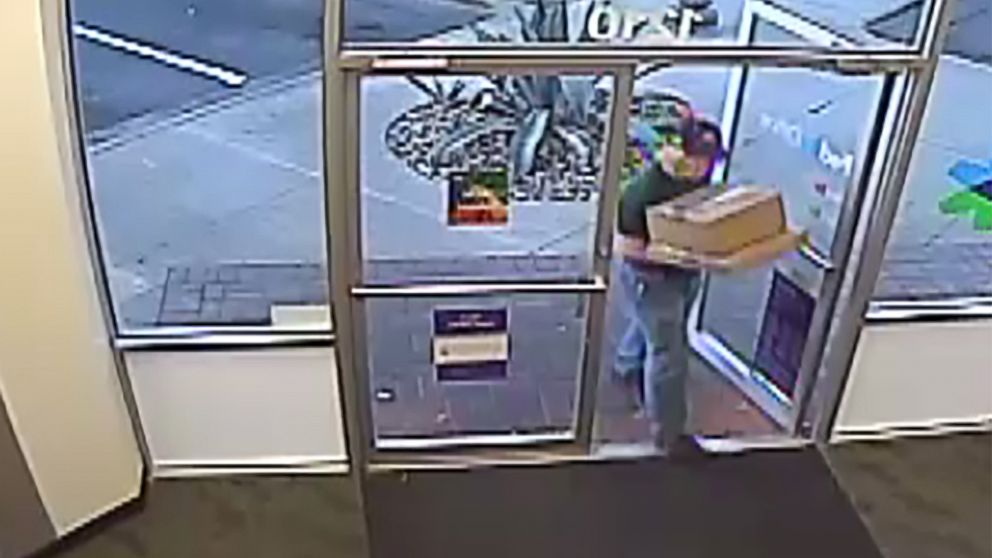 PHOTO: An image made from security camera footage appears to show a man identified by authorities as Austin bombing suspect Mark Conditt shipping two packages at a FedEx store on March 18, 2018.