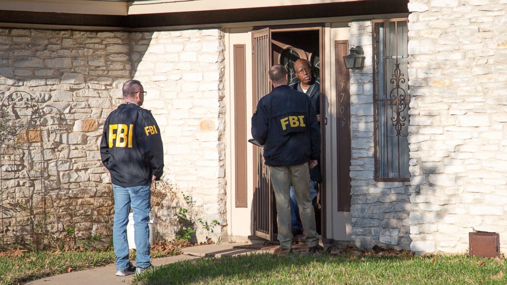 The FBi asks questions at the scene in East Austin, Texas, after a teenager was killed and a woman injured in the second Austin package explosion in the past two weeks, March 12, 2018.