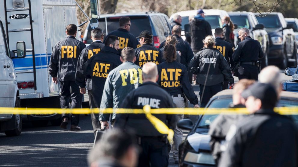 Authorities work on the scene of an explosion in Austin, March 12, 2018. 