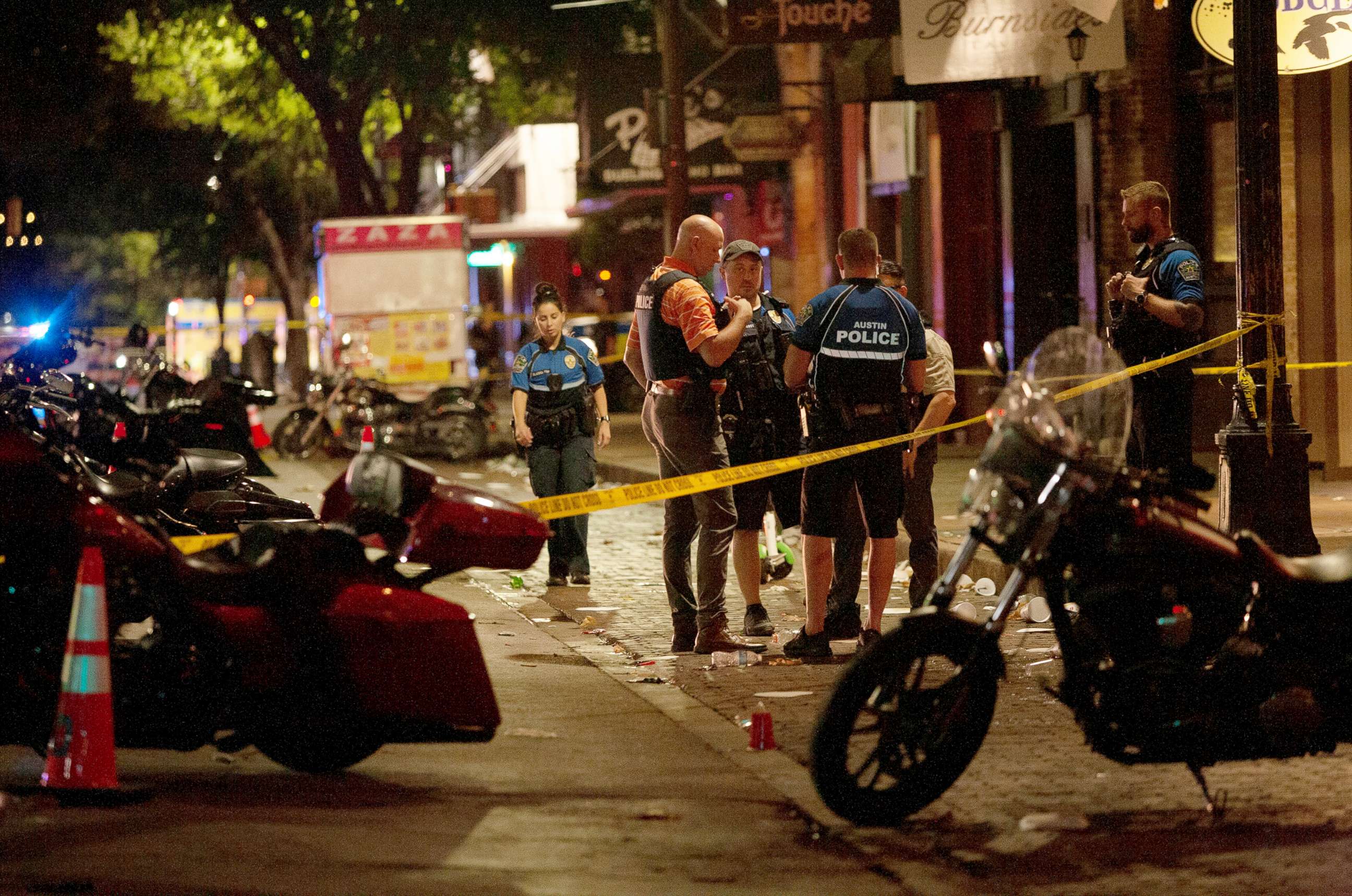 PHOTO: Police investigate the scene of a mass shooting in the Sixth Street entertainment district area of Austin, Texas, June 12, 2021.