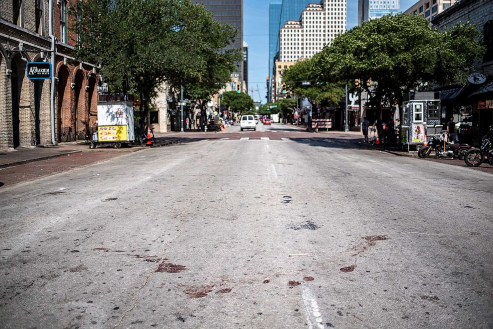 PHOTO: The street is stained with blood near the scene of a shooting in Austin, Texas, June 12, 2021. 