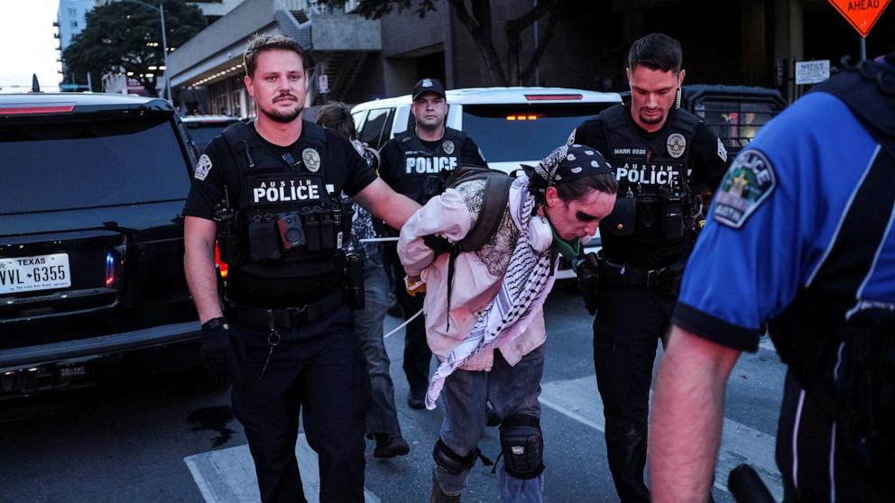 PHOTO: Police detain a protester during a rally in solidarity with Los Angeles protests against federal immigration sweeps, in Austin, Texas, June 9, 2025.