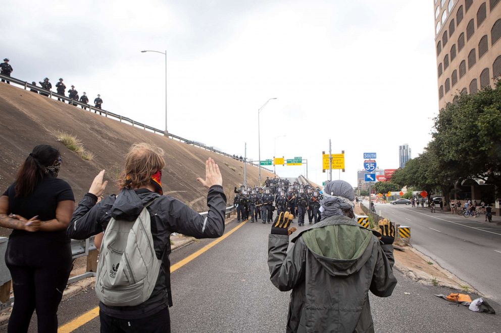 PHOTO: In this May 31, 2020, file photo, protesters resist the Austin Police Department's efforts to clear the streets around the Austin Police Department and Interstate 35, in Austin, Texas.