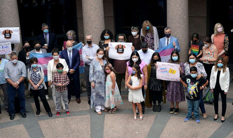 PHOTO: In this April 14, 2021, file photo, parents of transgender children and other supporters of transgender rights gather to speak about transgender legislation being considered in the Texas House and Texas Senate, in Austin, Texas. 