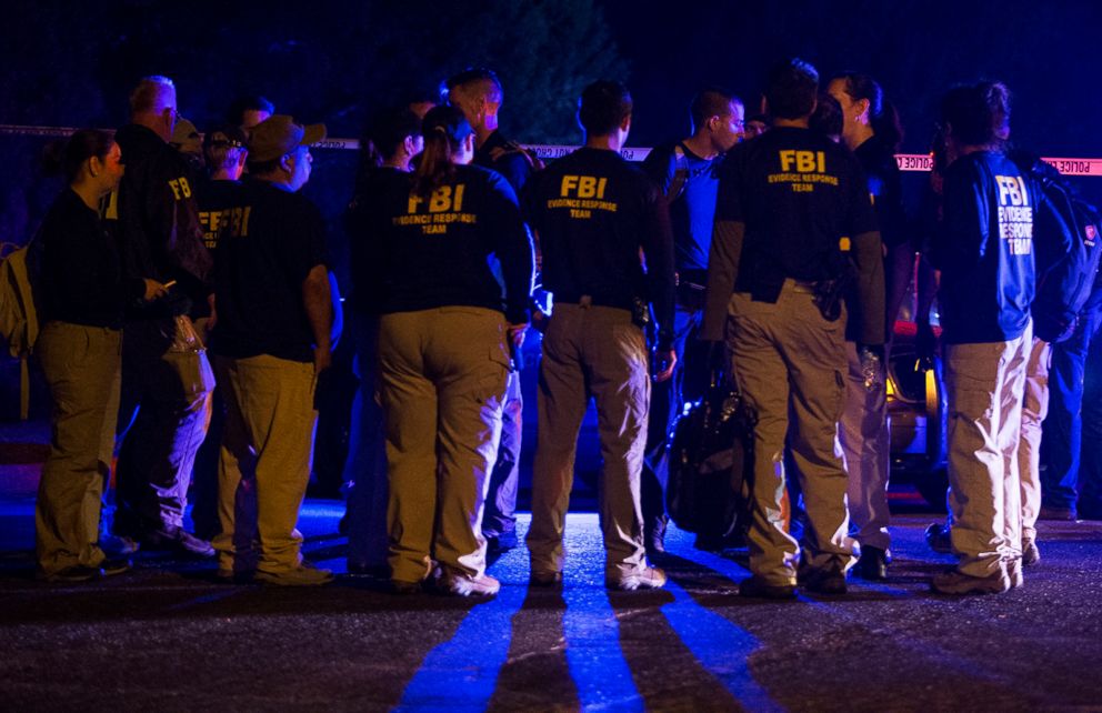 PHOTO: FBI agents meet at the scene of an explosion in Austin, Texas, Sunday, March 18, 2018.