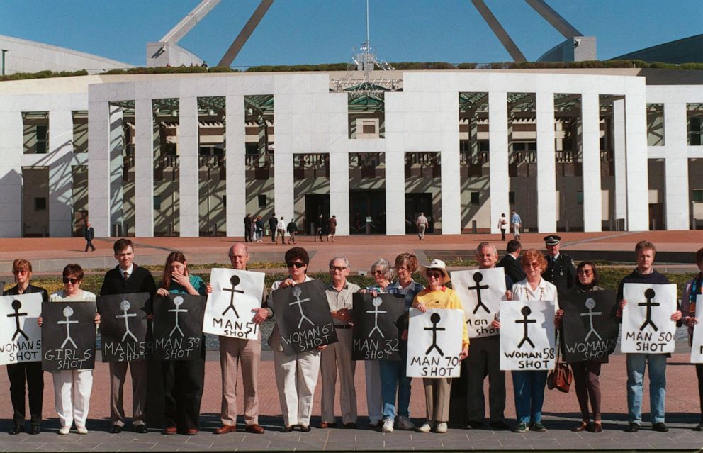 PHOTO: Anti-gun demonstrators hold signs representing victims killed in the Port Arthur massacre during a rally outside Parliament House in Canberra, Australia, May 10, 1996.