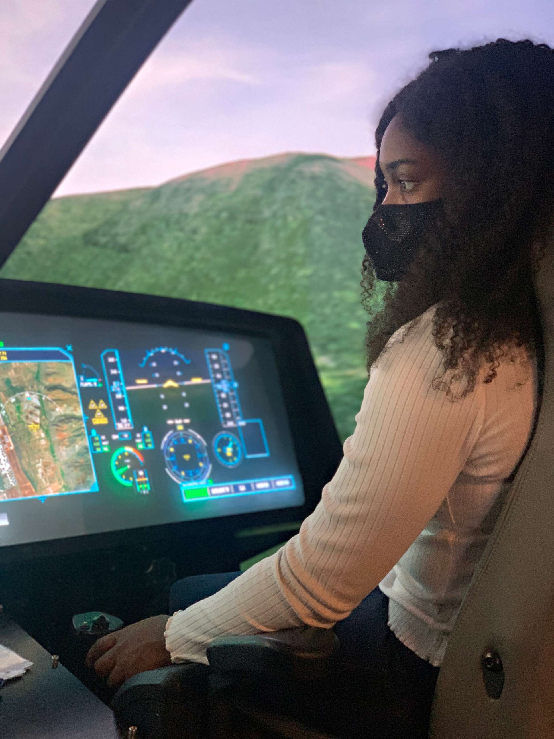 PHOTO: Pilot Abby Awosanya sits in the cockpit during pilot training, July 6, 2022.
