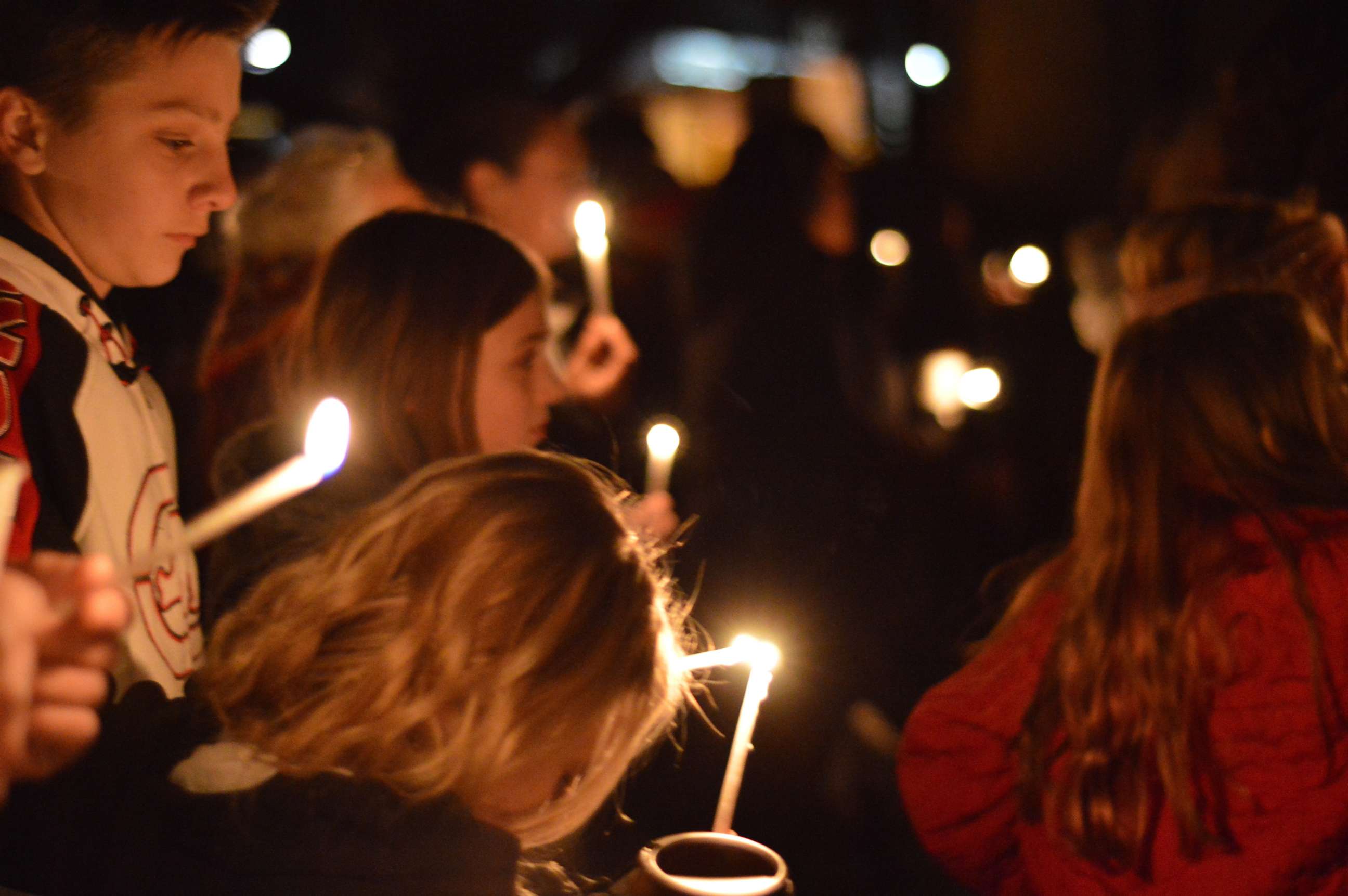 PHOTO: Aztec High School students and area residents gather for a candlelight vigil in Aztec, N.M., Dec. 7, 2017, after a shooting at the high school. 
