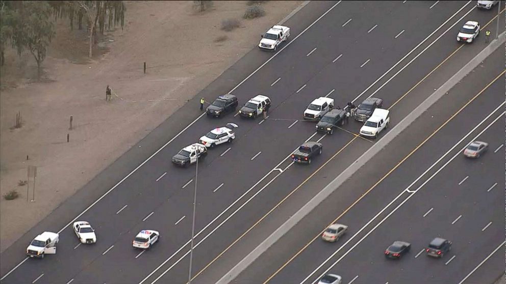 PHOTO: Officers work the scene on Interstate 10 eastbound near Avondale, Arizona where an Arizona Dept. of Public Safety Trooper was killed and one other officer was injured.