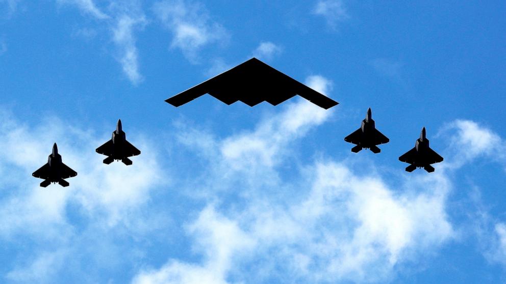 PHOTO: In this July 4, 2020, file photo, a U.S. Air Force B-2 Spirit Stealth Bomber is flanked by 4 U.S. Marine Corps F-35 fighters during a flyover of military aircraft down the Hudson River and New York Harbor.