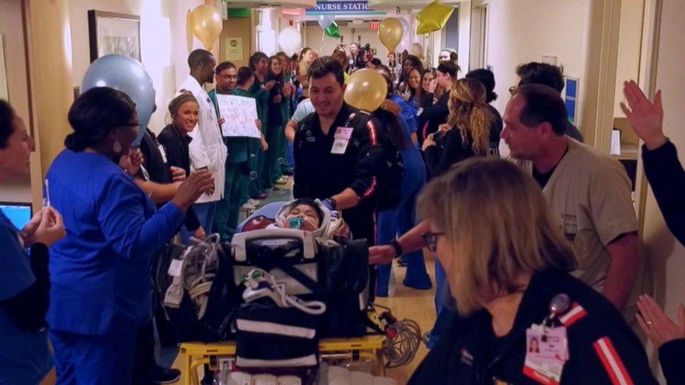 PHOTO: Staff celebrates as Jacob Rodriguez leaves the Dallas hospital Medical City Dallas after spending 685 in the hospital, Jan. 22, 2019.