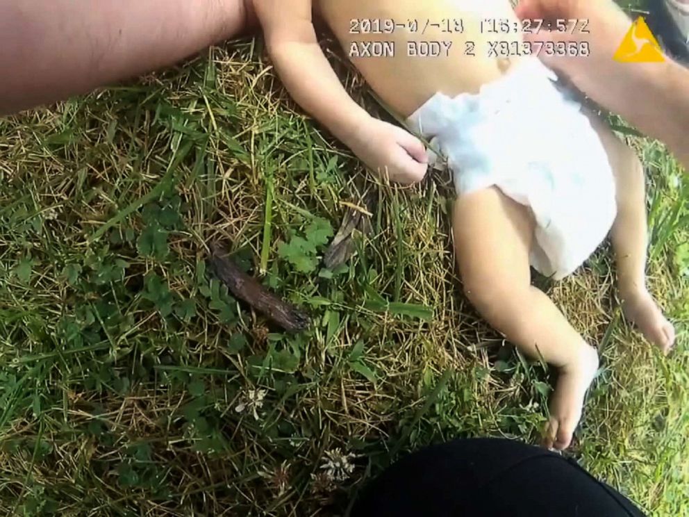 PHOTO: This image made from video captures a police officer performing CPR on a baby.