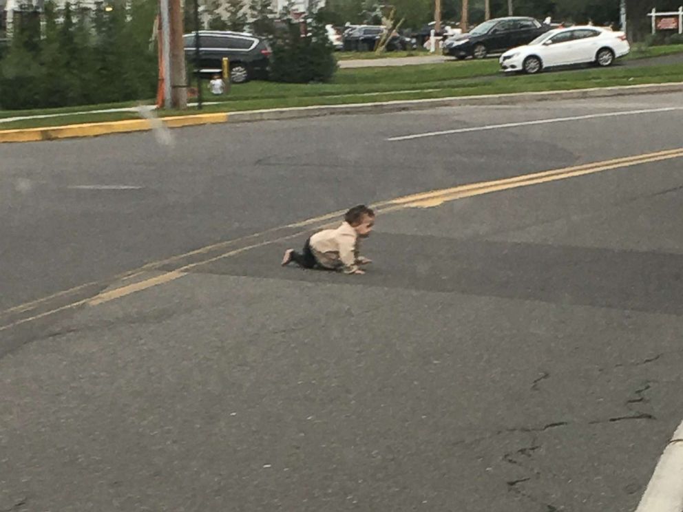 PHOTO: A baby crawls across Joe Parker Road in Lakewood Township, N.J., in a photo taken by a passing motorist who stopped to move the child off of the street.