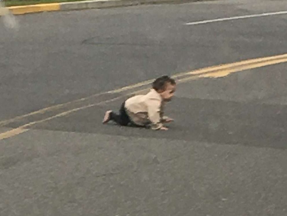 PHOTO: A baby crawls across Joe Parker Road in Lakewood Township, N.J., in a photo taken by a passing motorist who stopped to move the child off of the street.