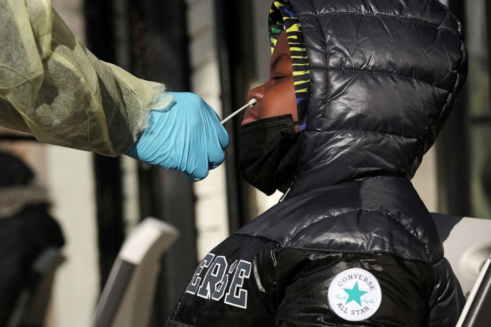 PHOTO: A Covid-19 test is given outside District Urgent Care in Washington,  Dec. 23, 2021.