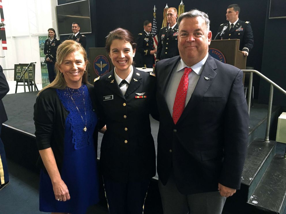 PHOTO: Army 1st Lt. Kathryn Bailey with her parents, Virginia Koch and Thomas Bailey, at her graduation from flight school at Fort Rucker, March 2017.