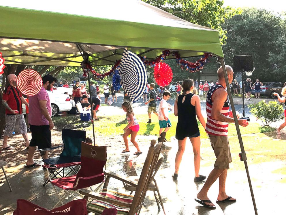 PHOTO: Residents of Riverton Drive in Austin, Texas, participate in a balloon fight during one of their annual block parties. 