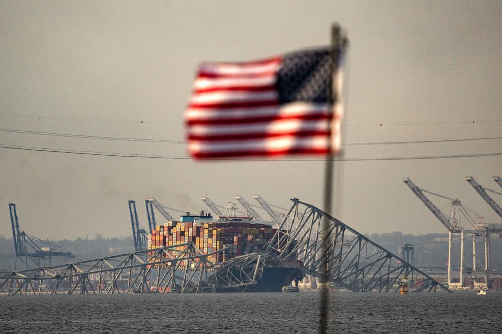PHOTO: Part of the steel frame of the Francis Scott Key Bridge sits on top of the container ship Dali after the bridge collapsed in Baltimore, Md., on March 26, 2024. 