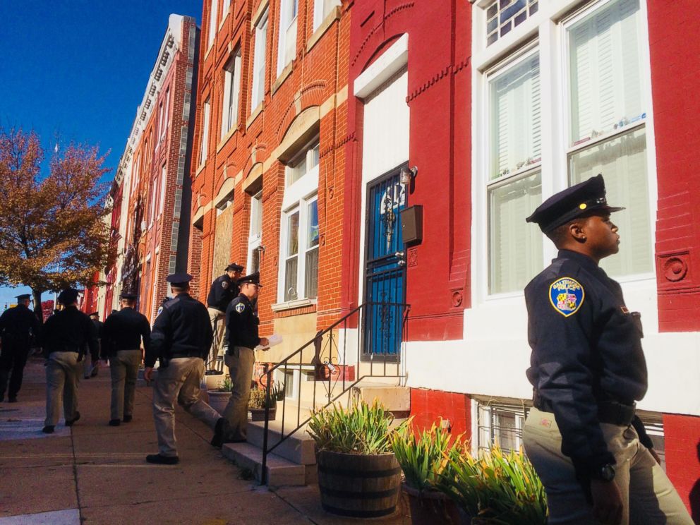 PHOTO: Baltimore police academy personnel canvass the area while detectives continue gathering evidence near the location where a police officer was shot, Nov. 16, 2017.