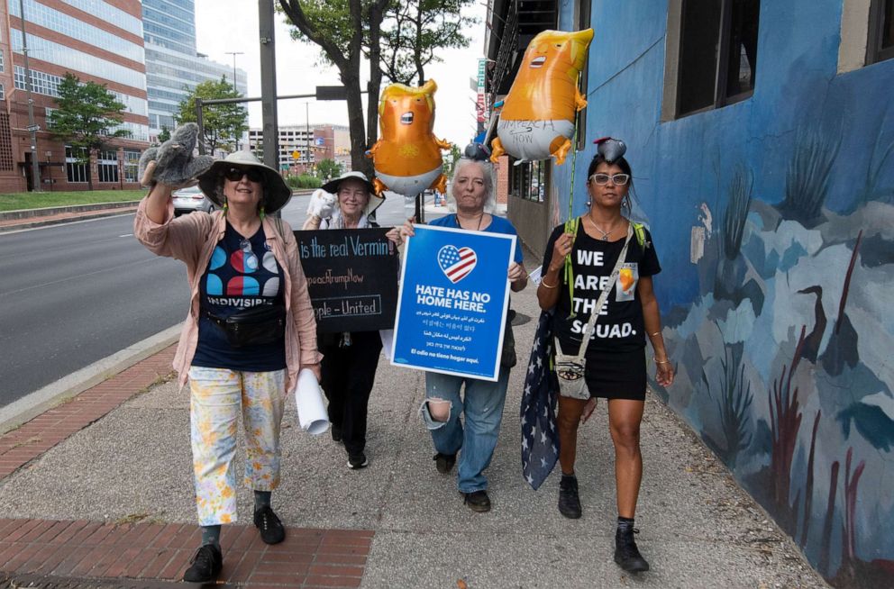 PHOTO: Protesters walk down the street towards the eastern edge of the Inner Harbor before President Donald Trump speaks in Baltimore, Sept. 12, 2019.