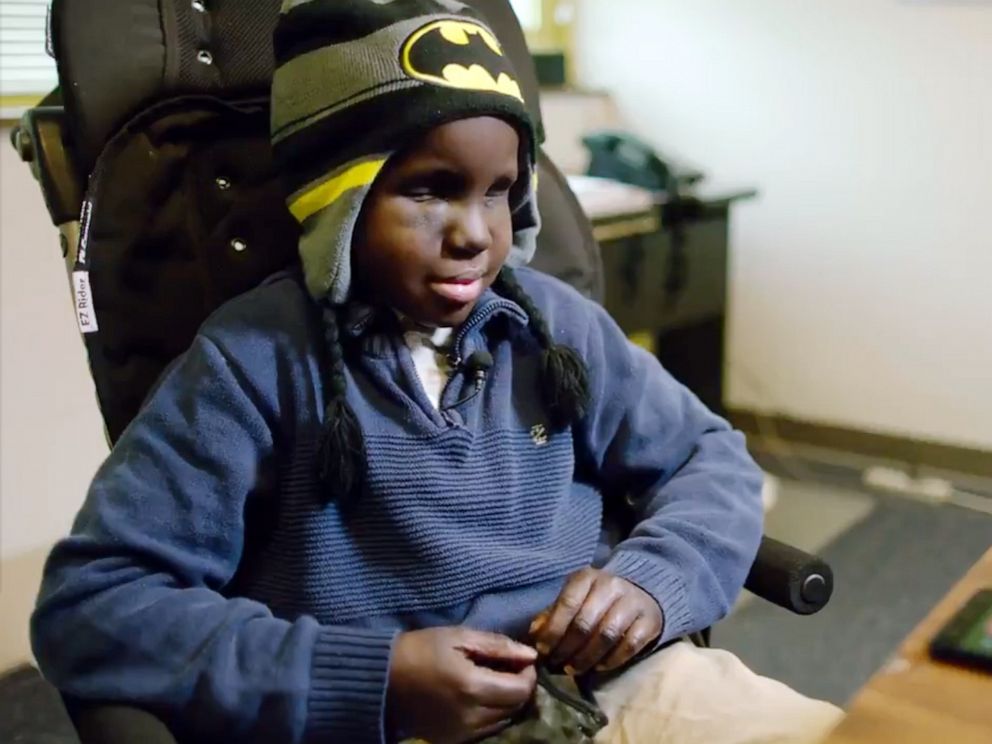 PHOTO: Ravens head coach John Harbaugh invited Mo Gaba, 13, to be the first person to read an NFL draft pick in Braille on Saturday, April 27, 2019, in Baltimore.