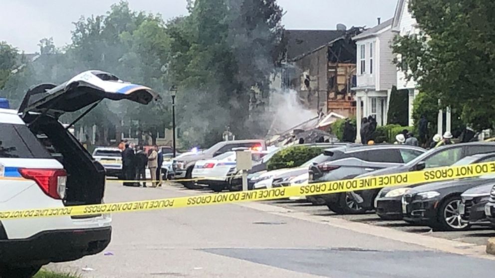 PHOTO: Police tape blocks the scene of a 2 alarm fire and police involved shooting with multiple fatalities in the Woodlawn area of Baltimore, May 8, 2021.