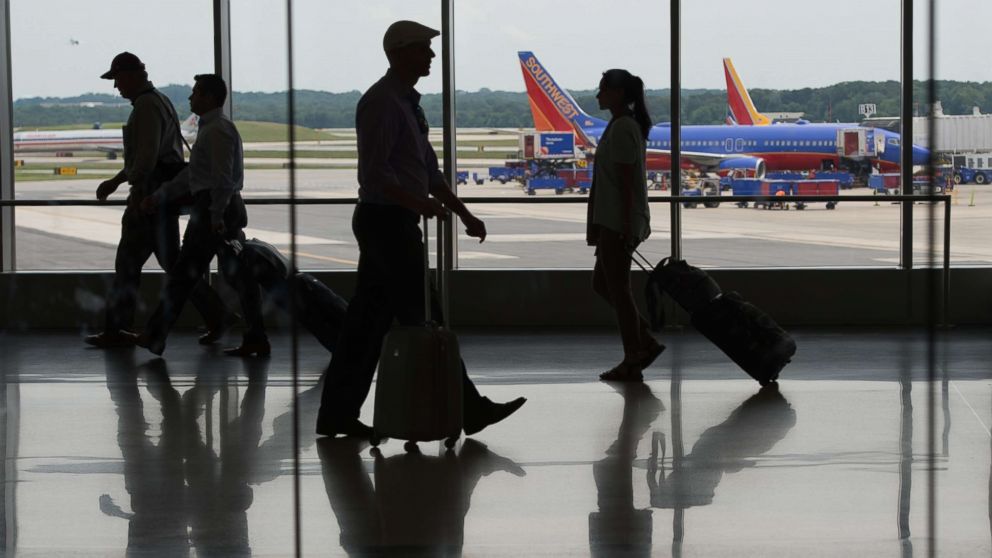 Passengers move through the terminal at Baltimore/Washington International Thurgood Marshall Airport, June 22, 2017 in Baltimore, Md.