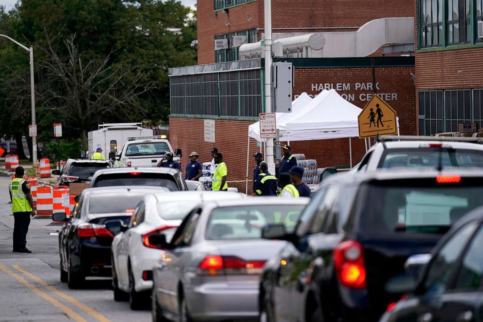 PHOTO: Residents of west Baltimore line up to receive a case of bottled water, on Sept. 6, 2022. City officials began distributing bottled water after harmful levels of E. Coli bacteria were detected in the drinking water.