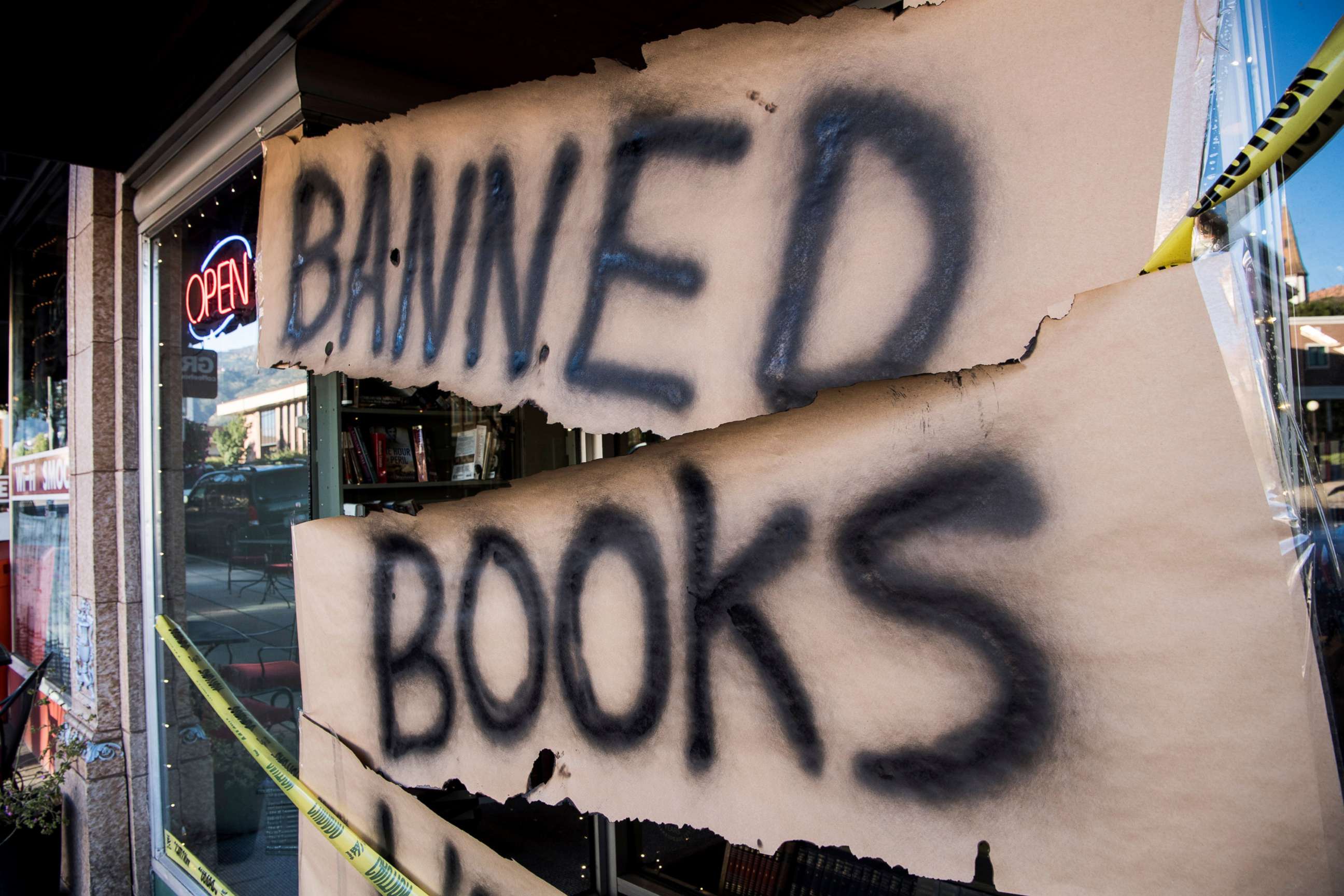 PHOTO: A sign wrapped in caution tape reading "Banned Books Week" is displayed at Main Street Books bookstore during Banned Books Week, on Sept. 26, 2018 in Cedar City, Utah. 