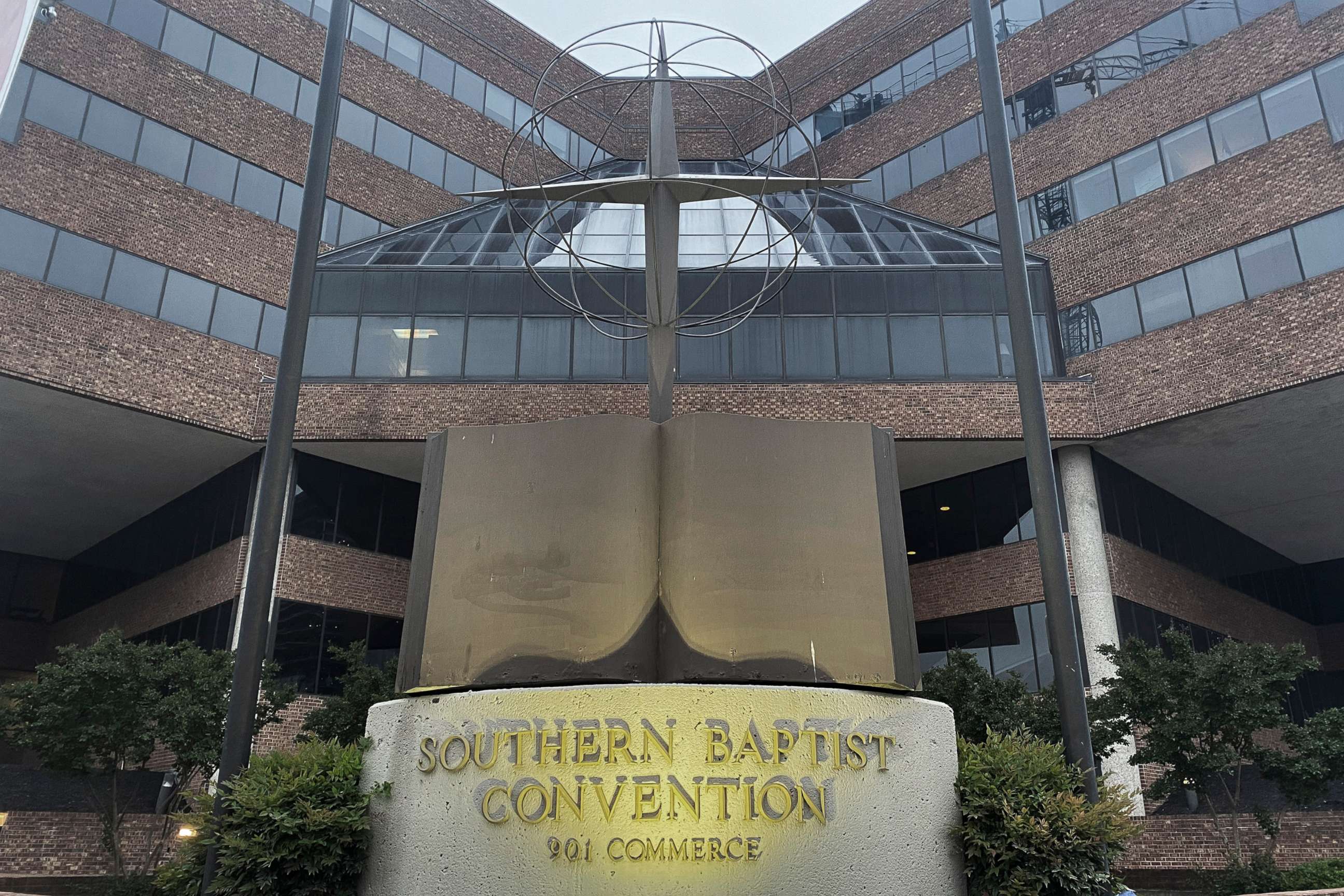 PHOTO: A cross and Bible sculpture stand outside the Southern Baptist Convention headquarters in Nashville, Tenn., May 24, 2022. 