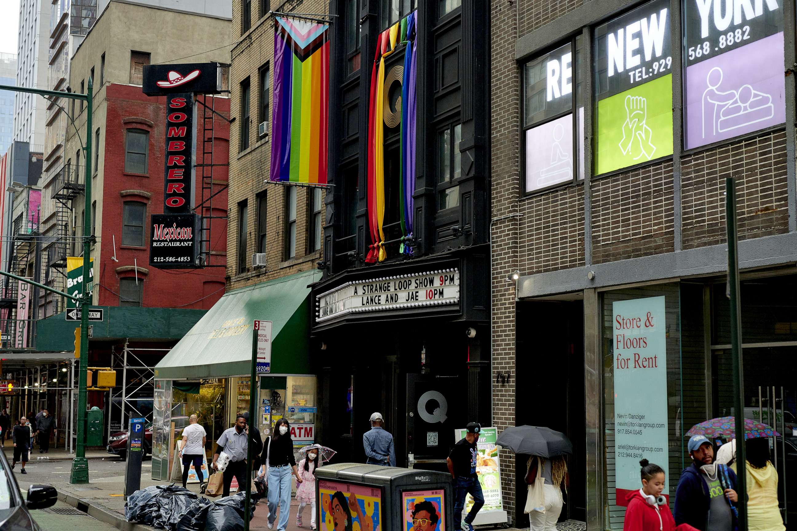 PHOTO: Pride flags hang outside of Q NYC bar in the Hell's Kitchen neighborhood of New York, June 22, 2022.